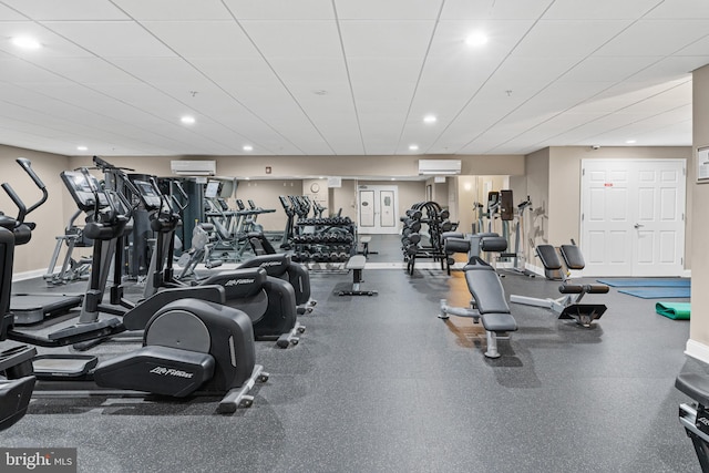 exercise room featuring a wall unit AC