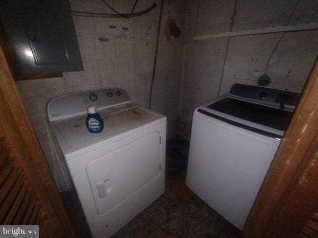 clothes washing area with washer and dryer