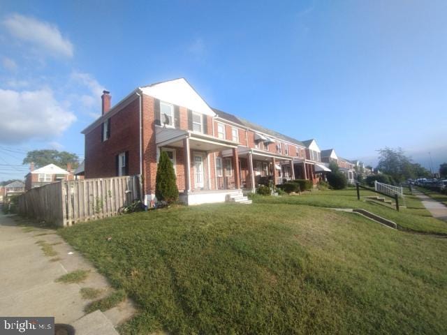 exterior space featuring a front yard and a porch