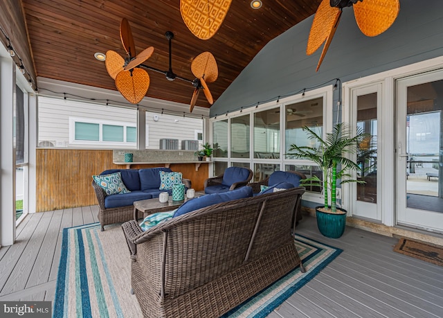 sunroom / solarium featuring wood ceiling, lofted ceiling, and ceiling fan