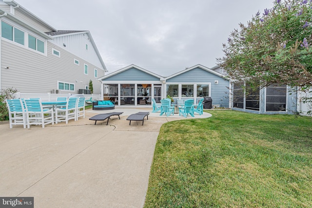 exterior space with a patio, cooling unit, area for grilling, a sunroom, and a yard