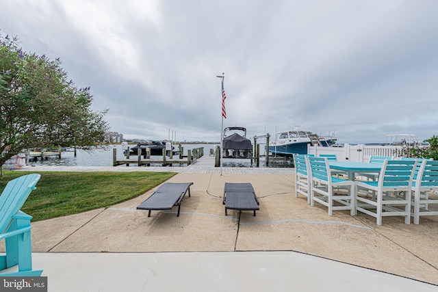 view of home's community featuring a patio and a water view