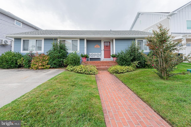 ranch-style house with a front lawn