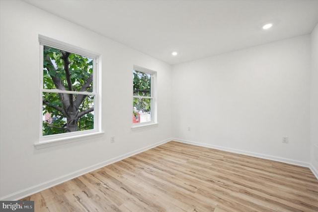 spare room with light wood-type flooring