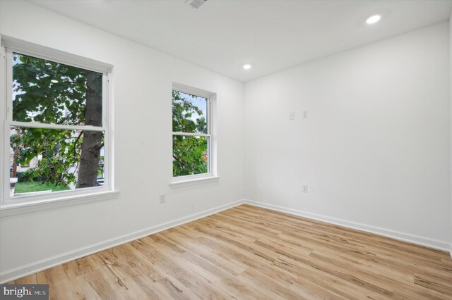 unfurnished room featuring light hardwood / wood-style floors