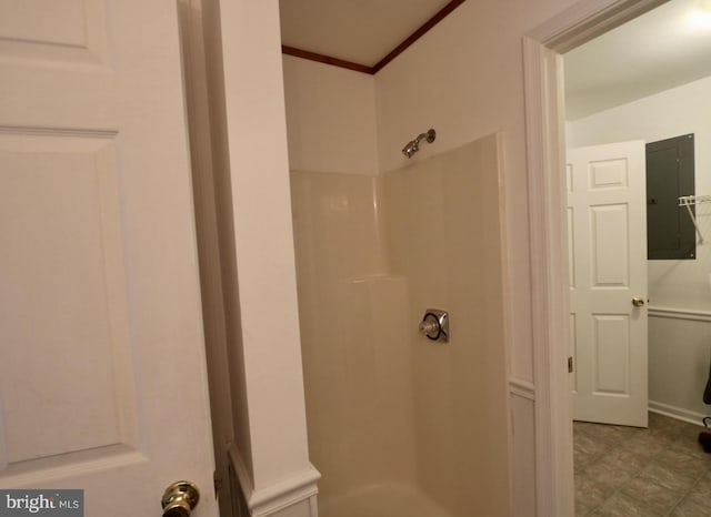 bathroom with a shower and electric panel