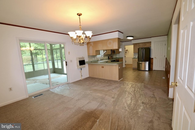 kitchen with heating unit, a chandelier, kitchen peninsula, hanging light fixtures, and stainless steel appliances