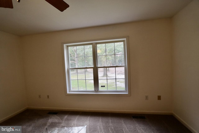 carpeted empty room with ceiling fan