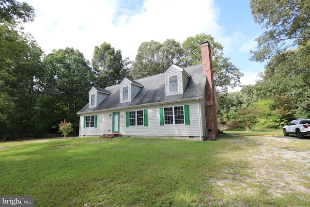 cape cod home featuring a front lawn