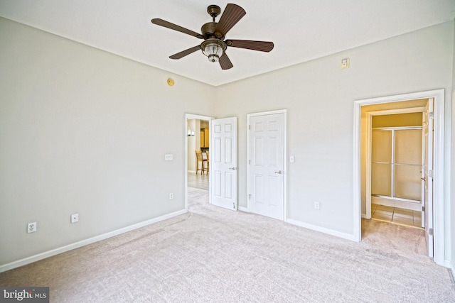 unfurnished bedroom featuring light carpet and ceiling fan