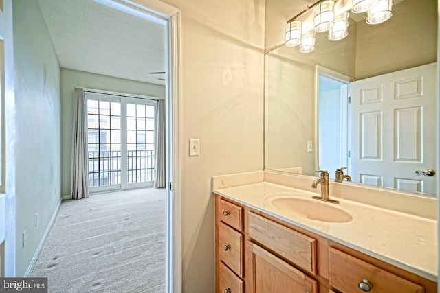 bathroom featuring vanity and a textured ceiling