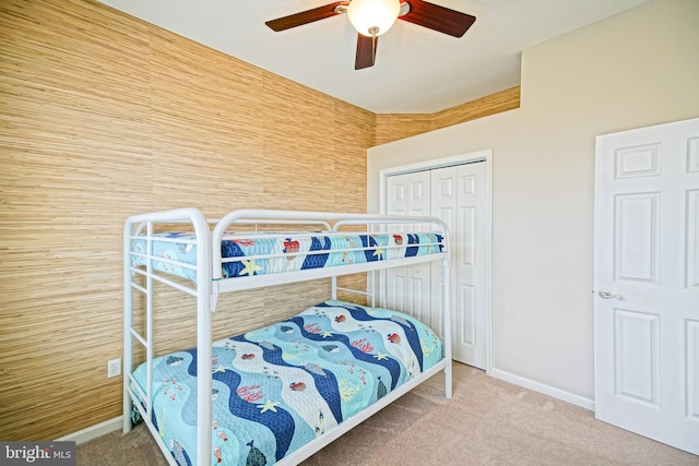 bedroom featuring carpet flooring, a closet, and ceiling fan