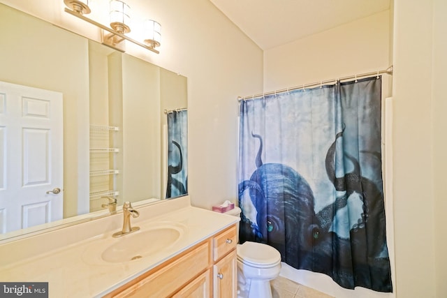 bathroom featuring tile patterned flooring, vanity, a shower with shower curtain, and toilet