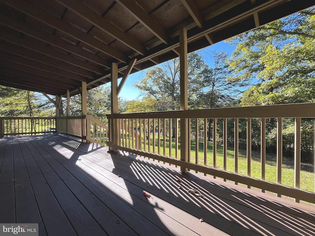 wooden terrace with a yard