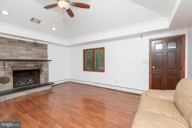 unfurnished living room with ceiling fan, a stone fireplace, hardwood / wood-style floors, crown molding, and baseboard heating