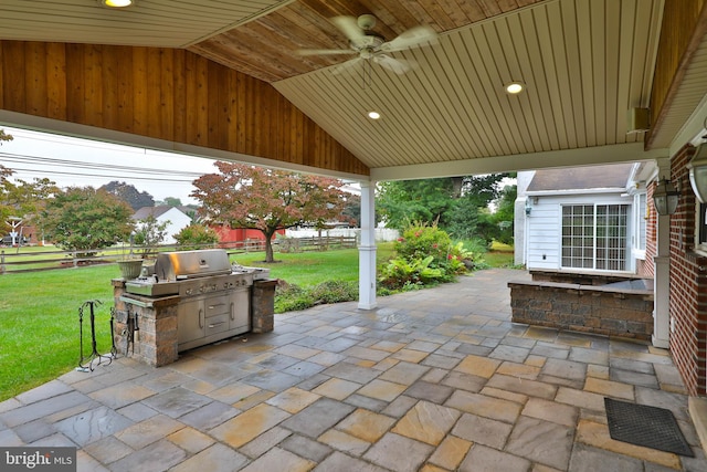 view of patio featuring ceiling fan and an outdoor kitchen