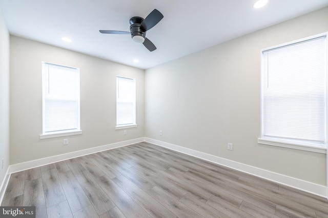 spare room with ceiling fan and light hardwood / wood-style flooring