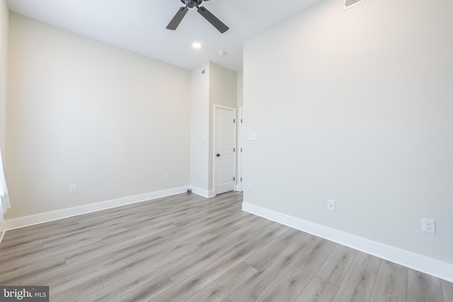 unfurnished room with ceiling fan and light hardwood / wood-style flooring