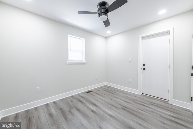 empty room with light hardwood / wood-style floors and ceiling fan