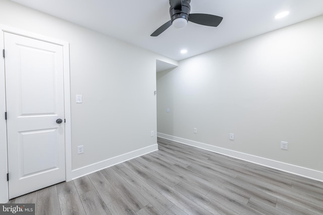 unfurnished room with light wood-type flooring and ceiling fan