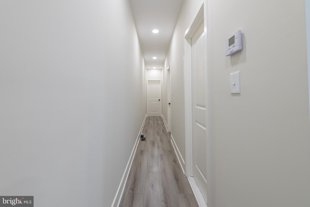 corridor featuring light hardwood / wood-style flooring