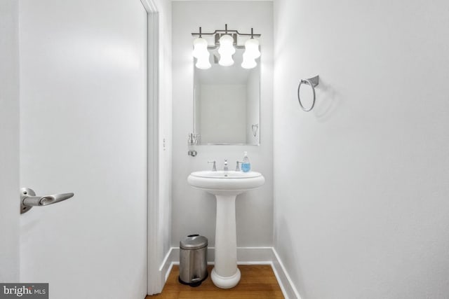 bathroom featuring baseboards and wood finished floors