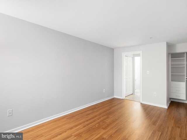 unfurnished bedroom featuring hardwood / wood-style flooring