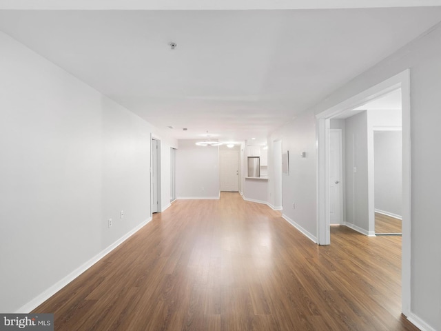 unfurnished room featuring hardwood / wood-style flooring