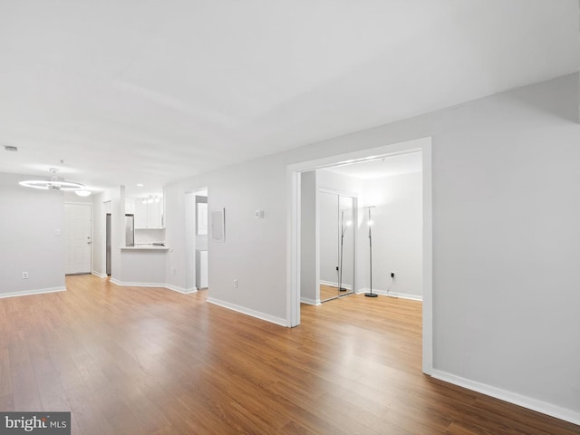 spare room with light hardwood / wood-style flooring