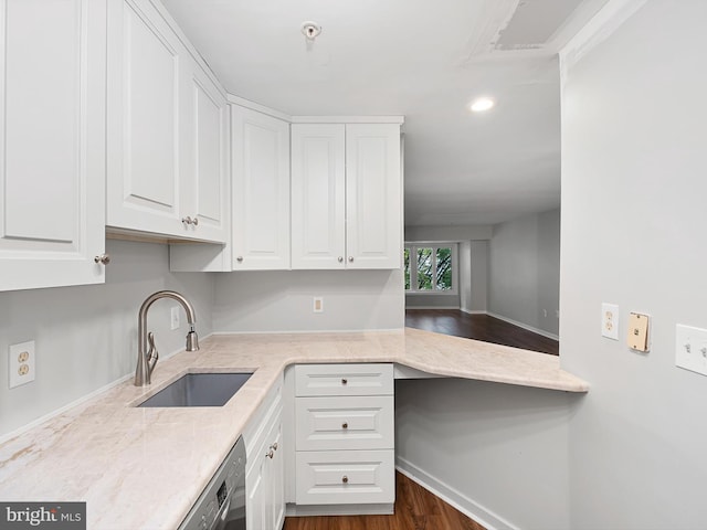 kitchen featuring light stone counters, white cabinets, dark hardwood / wood-style floors, and sink