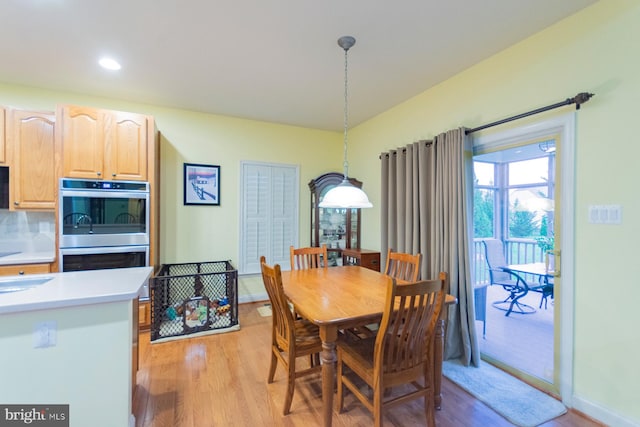 dining area with light hardwood / wood-style floors