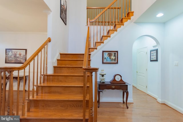 staircase featuring wood-type flooring