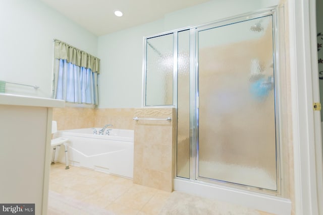 bathroom with separate shower and tub