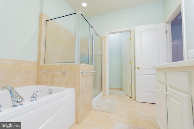 bathroom featuring shower with separate bathtub and tile patterned flooring