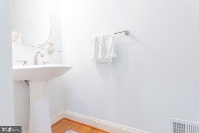 bathroom featuring wood-type flooring