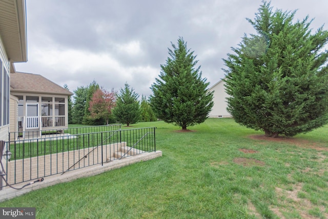 view of yard with a sunroom