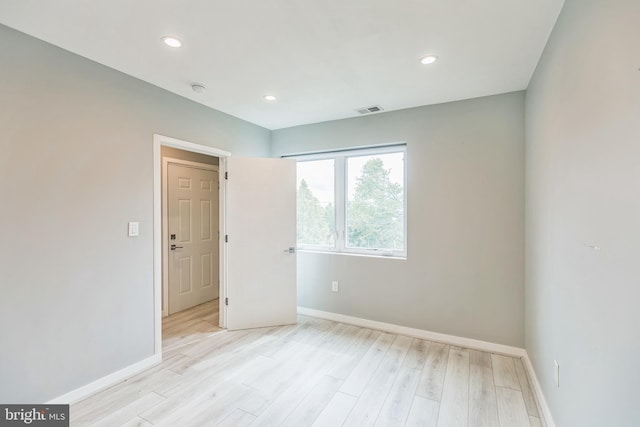 empty room with light wood-type flooring