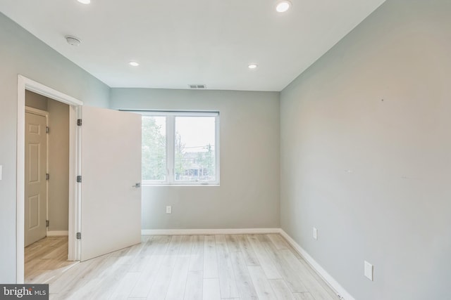 unfurnished room featuring light wood-type flooring