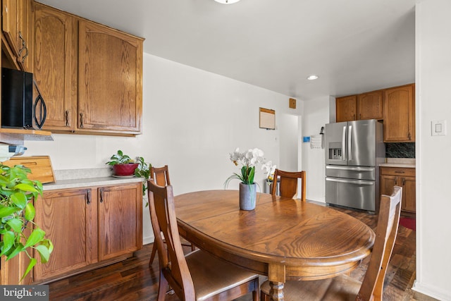 dining area featuring dark hardwood / wood-style flooring