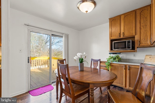 dining area with dark wood-type flooring