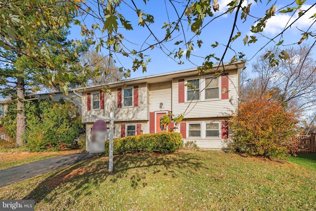 bi-level home with a front lawn