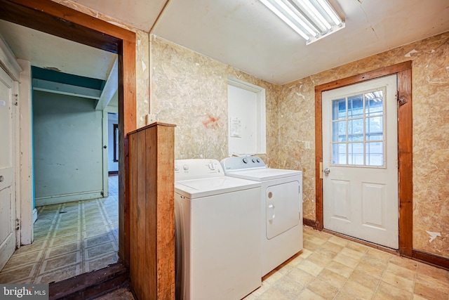 clothes washing area featuring washer and clothes dryer