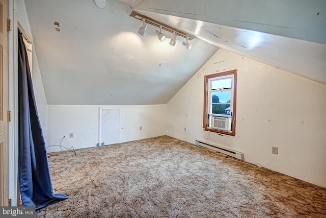 additional living space with carpet, vaulted ceiling, cooling unit, and a baseboard radiator