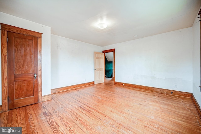 spare room featuring light hardwood / wood-style floors