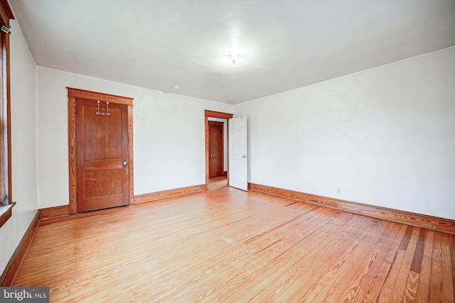 unfurnished bedroom with light wood-type flooring