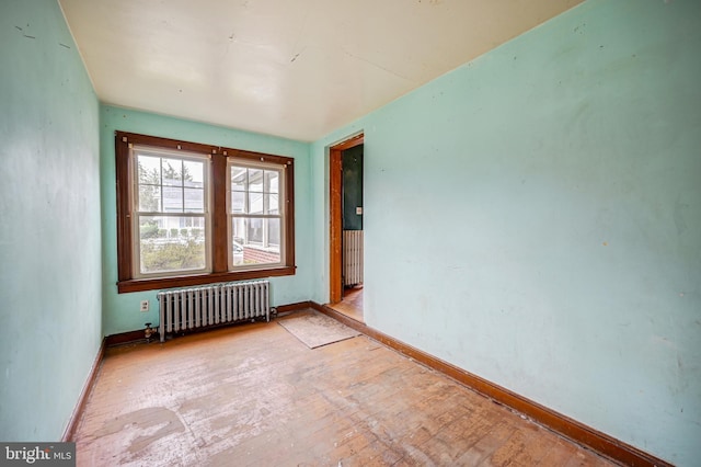 unfurnished room with radiator