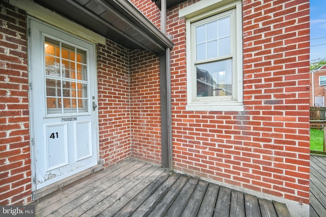 doorway to property with a wooden deck