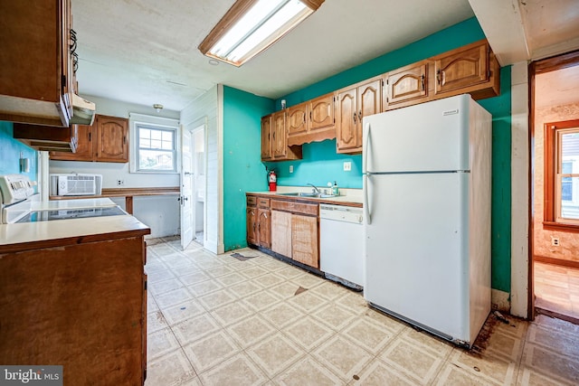 kitchen featuring sink and white appliances