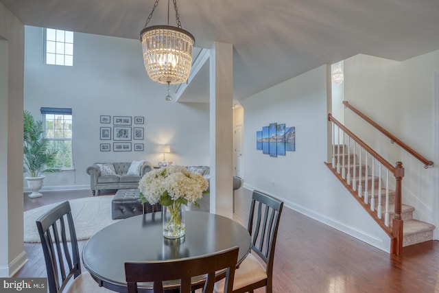 dining room featuring an inviting chandelier and wood-type flooring