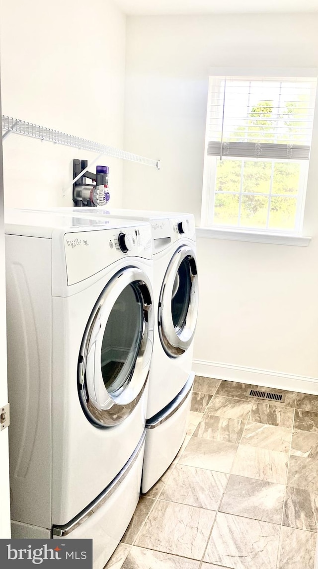 washroom with separate washer and dryer